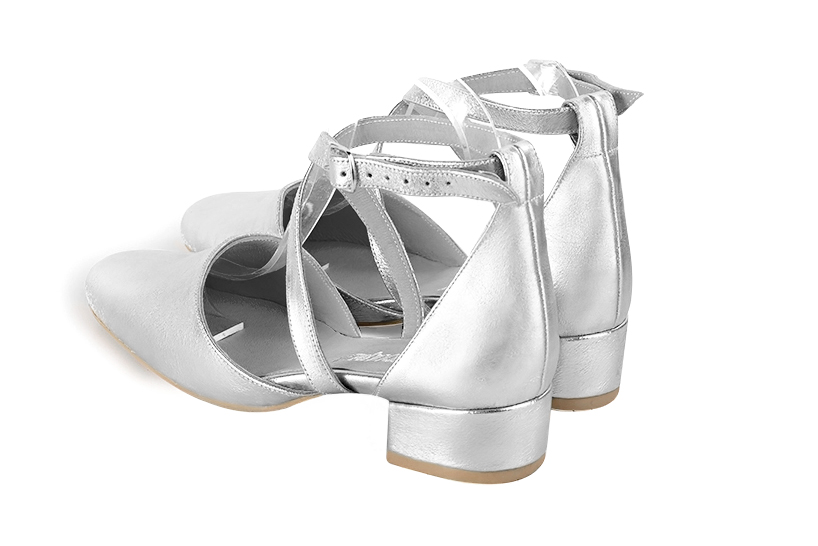 Light silver women's open side shoes, with crossed straps. Round toe. Low block heels. Rear view - Florence KOOIJMAN